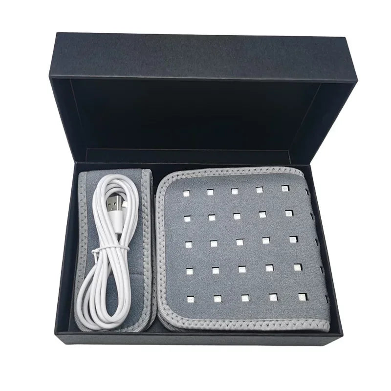 Gray LED light therapy pad and USB charging cable in a black box