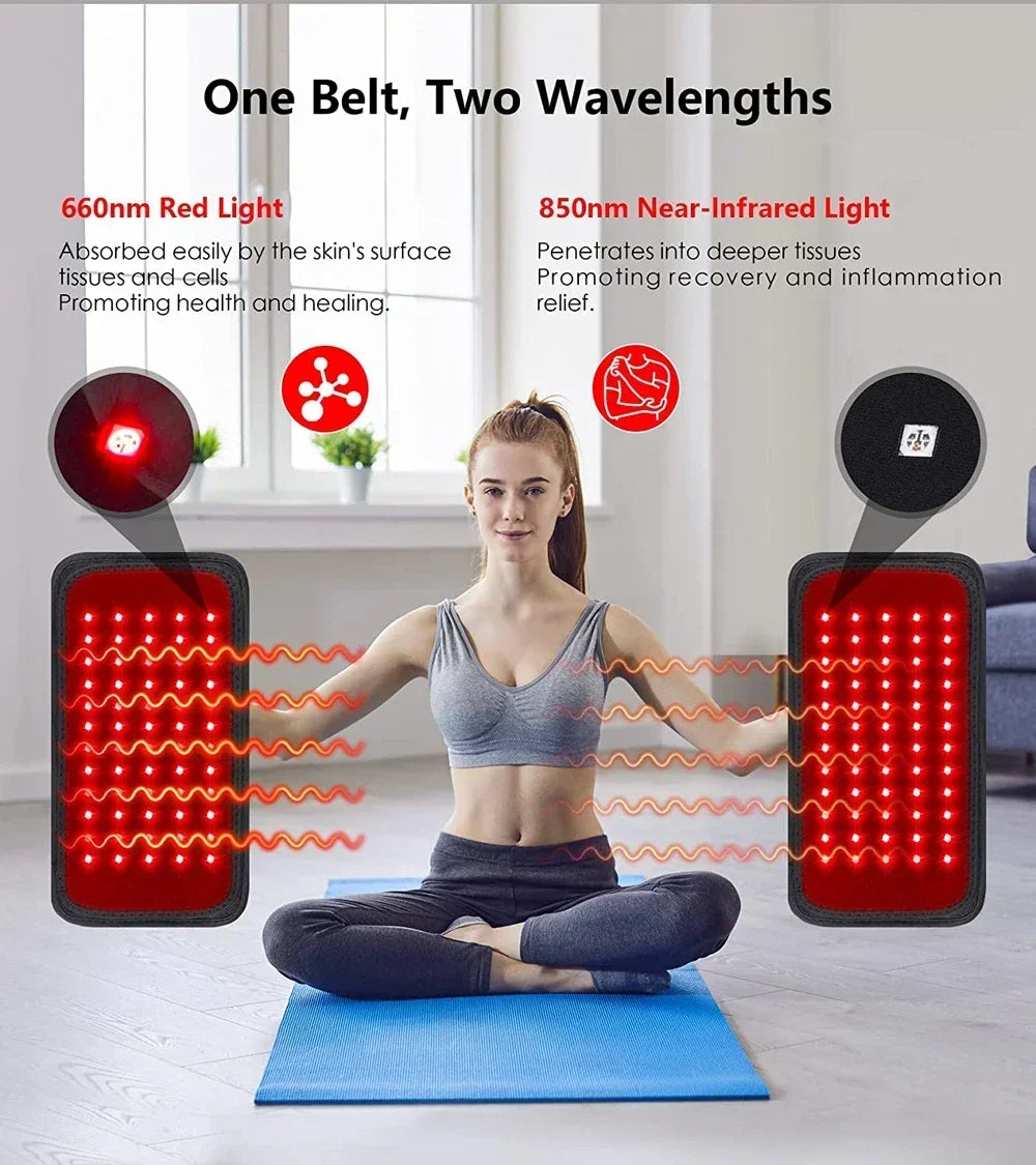 Woman using red and near-infrared light therapy belt while sitting on yoga mat indoors